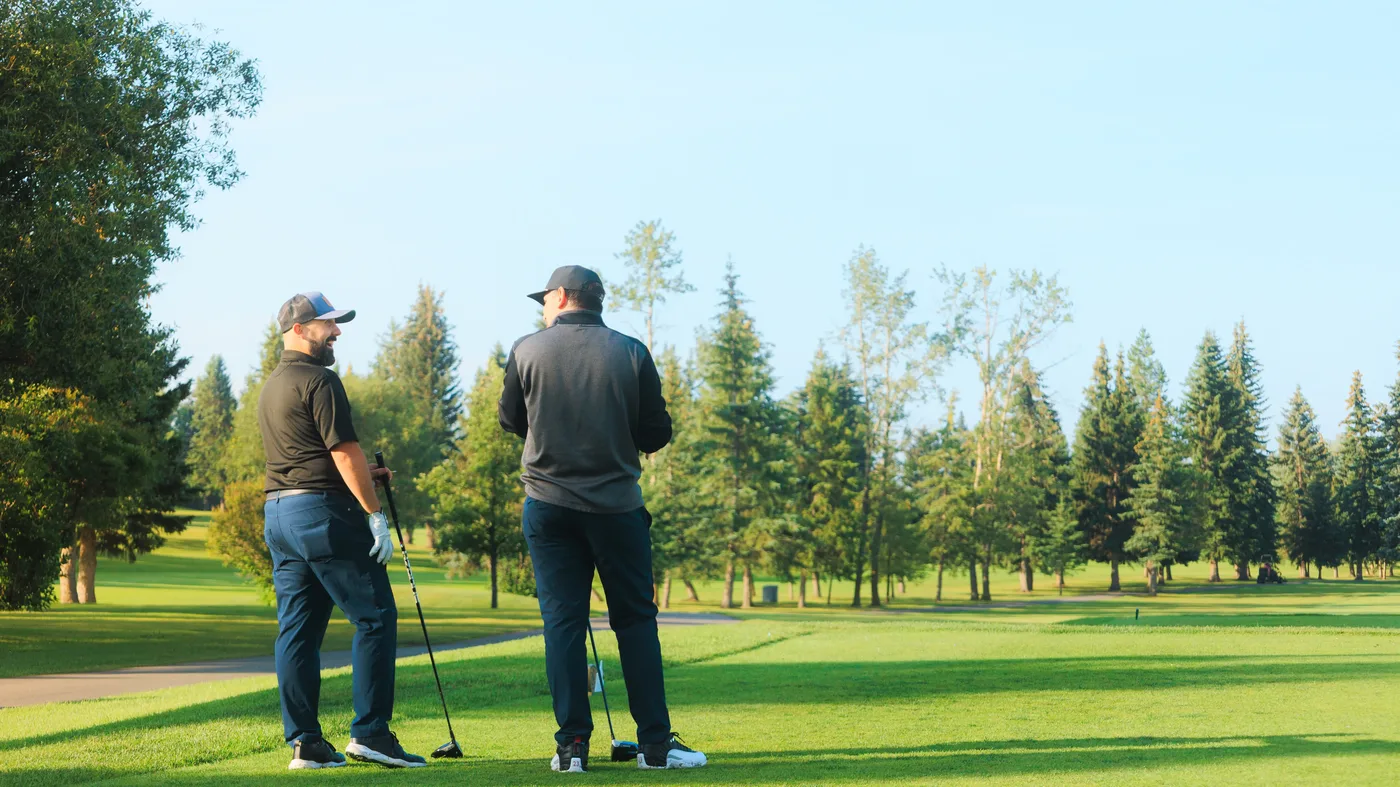 Golfers on the fairway at Sturgeon Valley Golf Club